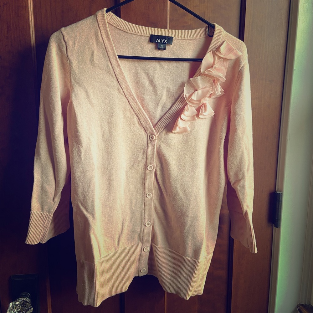Feminine blush cardigan with accent trim